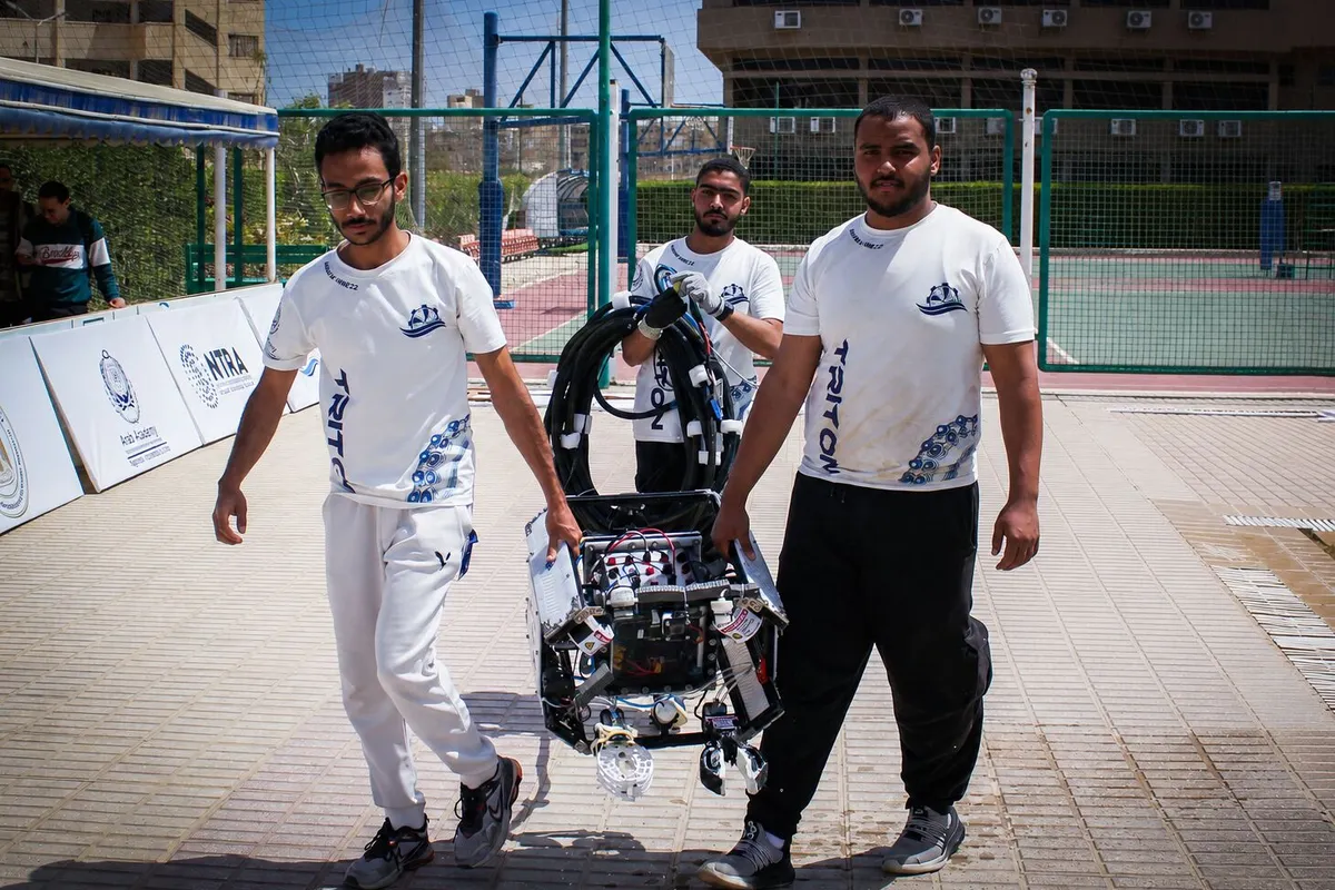 Members carrying the remotely operated vehicle post mission